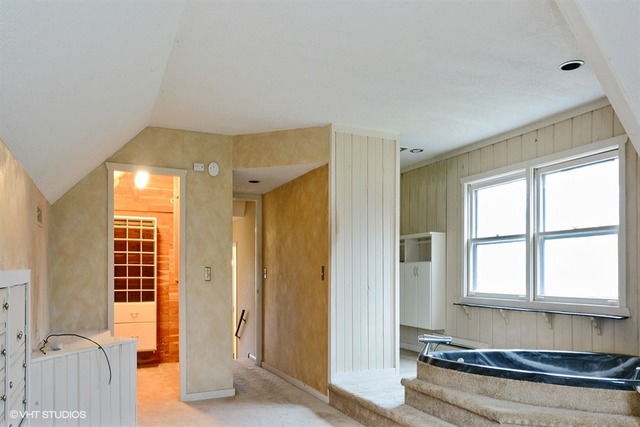 356 South Ela Road Inverness, IL 60010 - Photo 16 of 25 a view of hallway with windows and chandelier