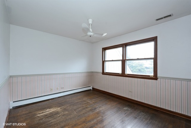356 South Ela Road Inverness, IL 60010 - Photo 18 of 25 an empty room with wooden floor and windows