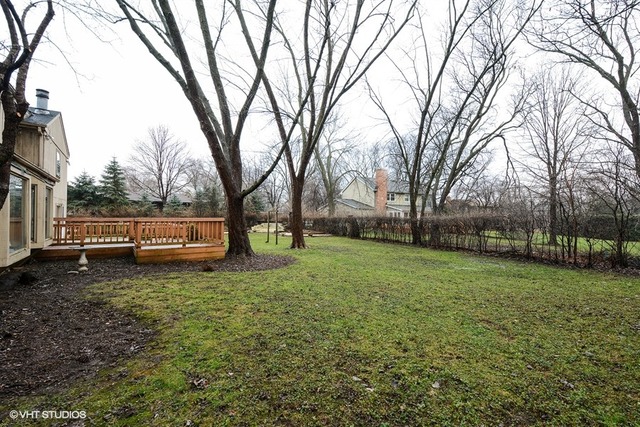 356 South Ela Road Inverness, IL 60010 - Photo 22 of 25 a view of a backyard with large trees
