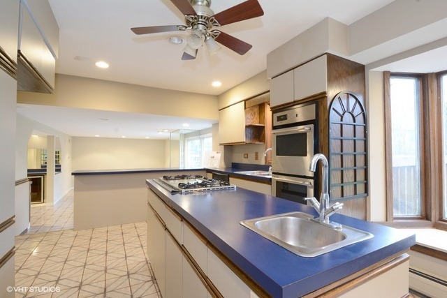 356 South Ela Road Inverness, IL 60010 - Photo 6 of 25 a kitchen with granite countertop a sink appliances and cabinets