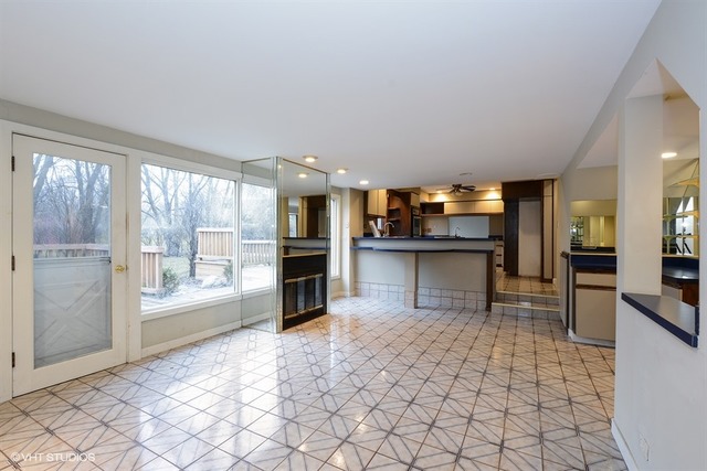 356 South Ela Road Inverness, IL 60010 - Photo 7 of 25 a view of a kitchen with kitchen island granite countertop a refrigerator cabinets and a stove