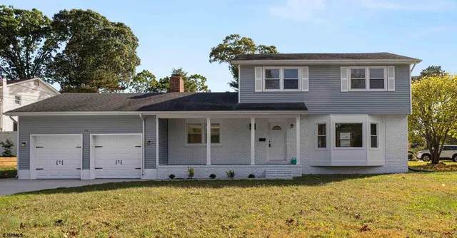 a house view with a garden space