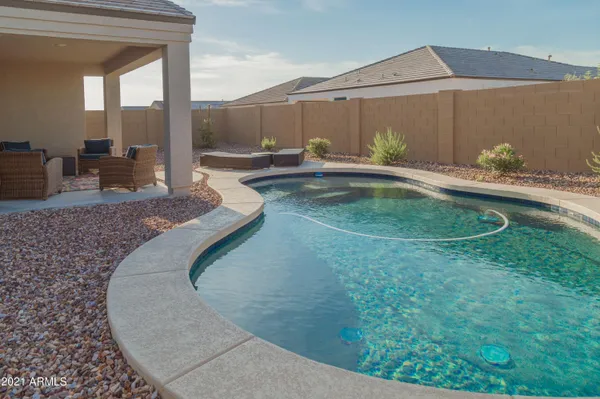 swimming pool view with a outdoor seating