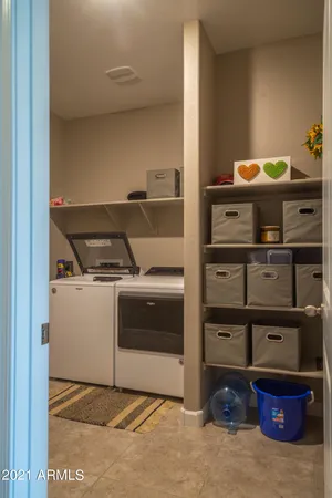 a utility room with washer and dryer