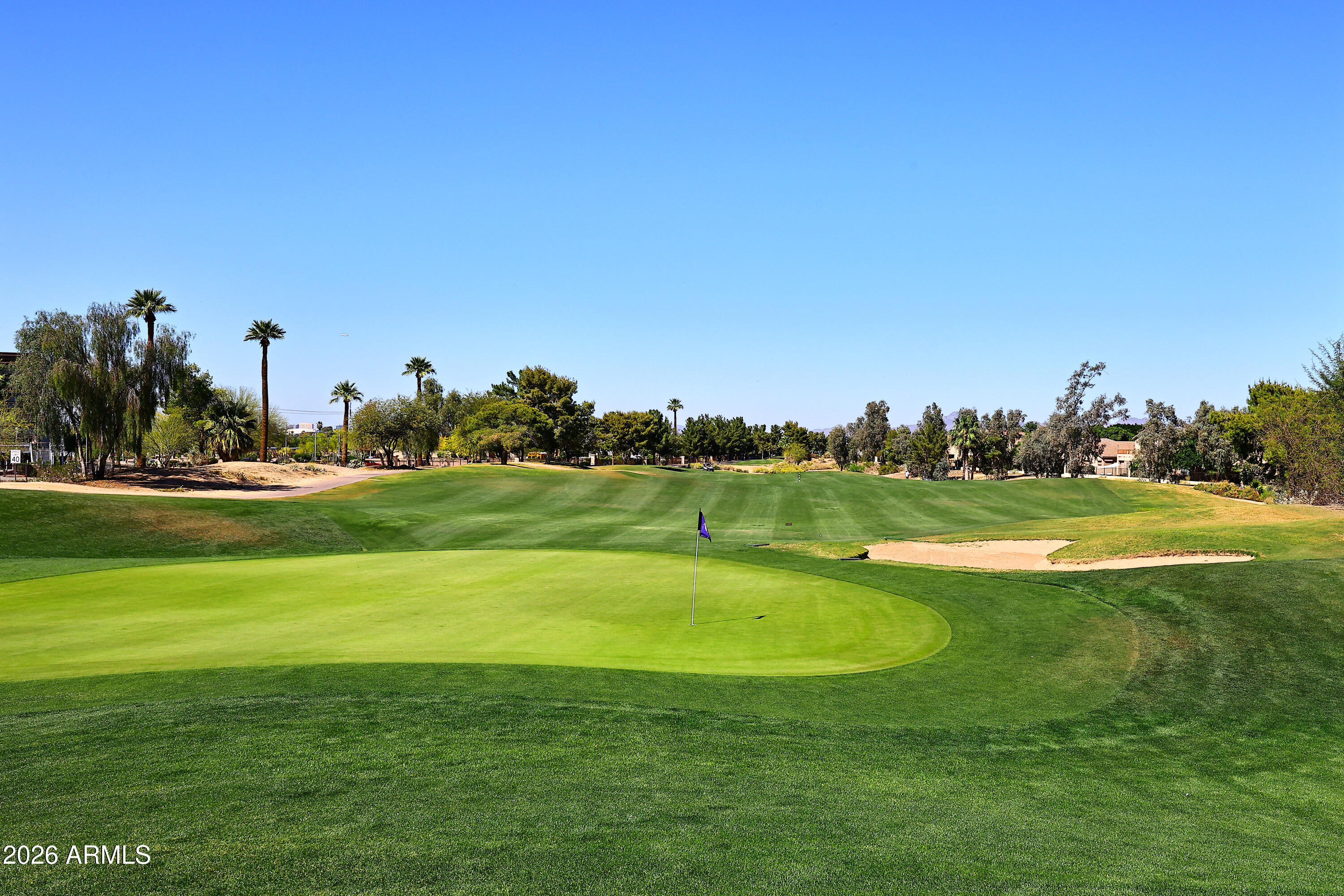 2635 East Darrel Road Phoenix, AZ 85042 - Photo 11 of 27 a view of a golf course with a lake