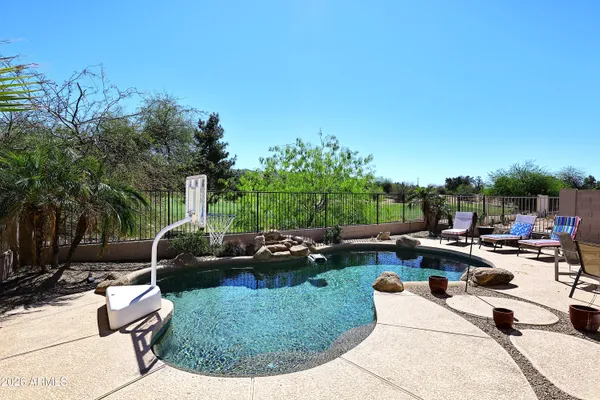 a view of a backyard with sitting area