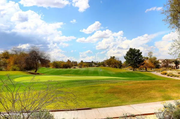 a view of a golf course with a lake