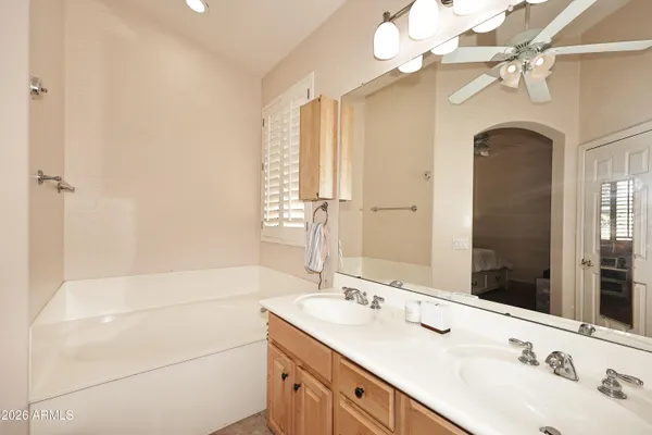 a bathroom with 2 sink and a mirror