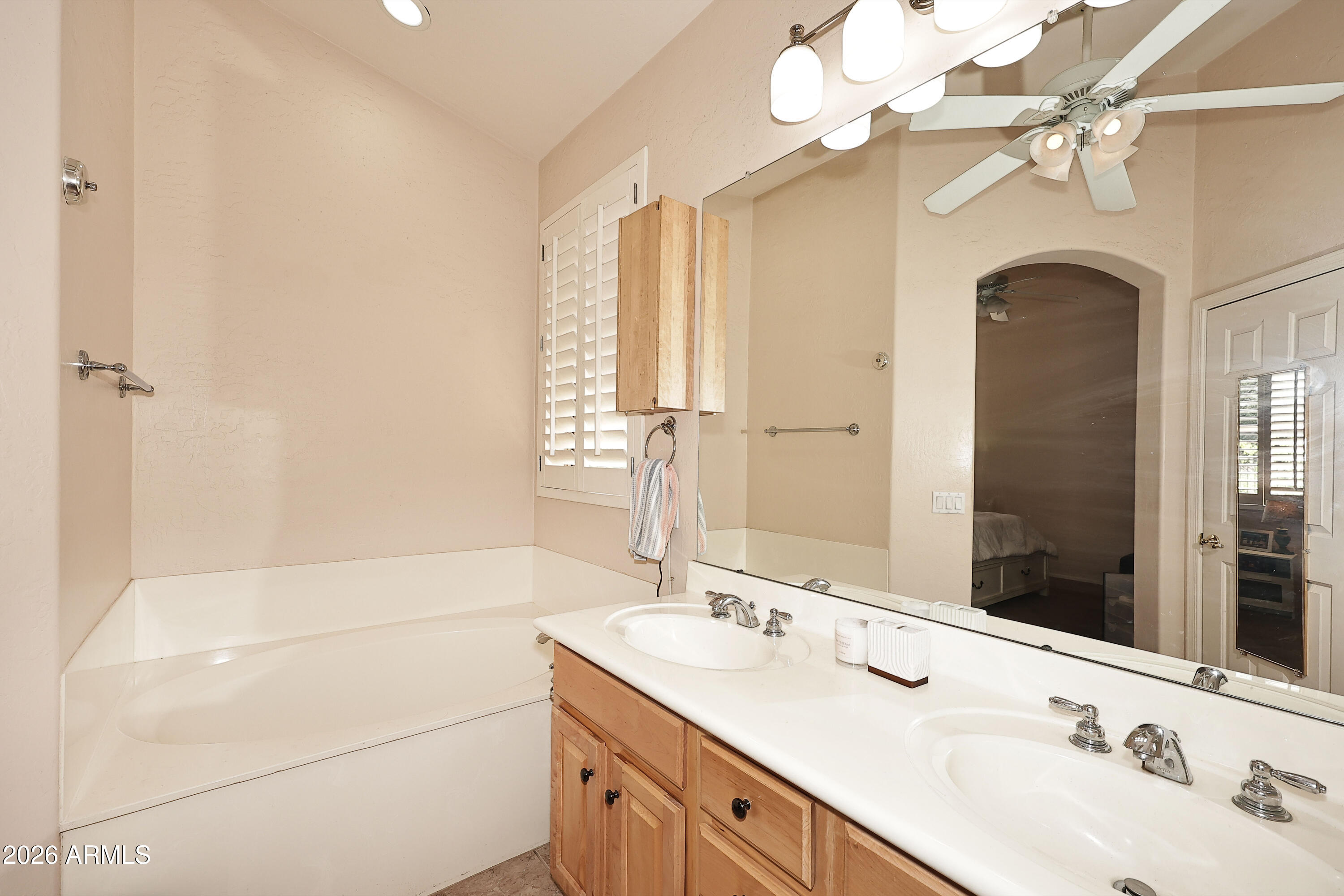 2635 East Darrel Road Phoenix, AZ 85042 - Photo 18 of 27 a bathroom with 2 sink and a mirror