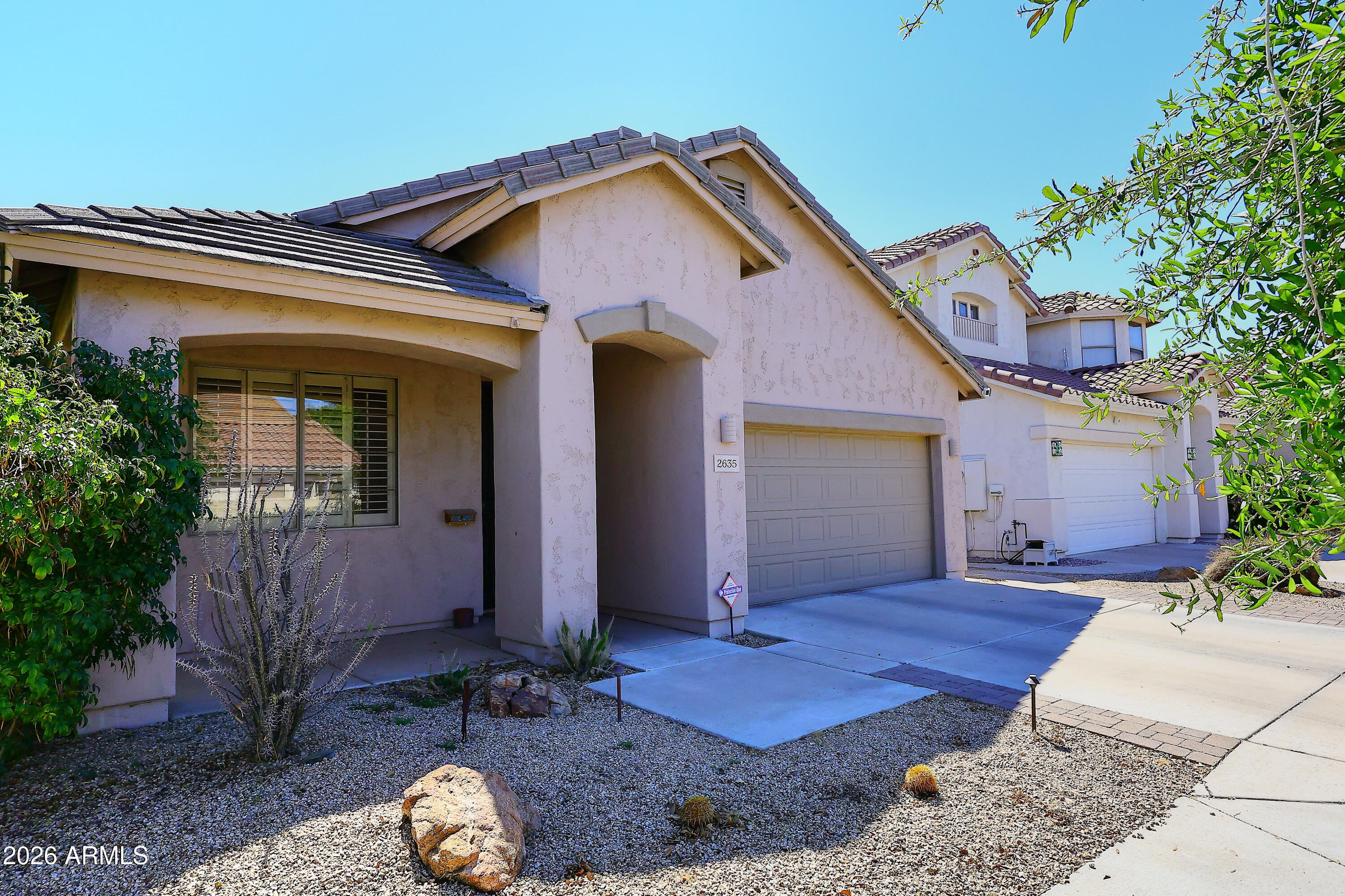 2635 East Darrel Road Phoenix, AZ 85042 - Photo 2 of 27 a front view of a house with garden