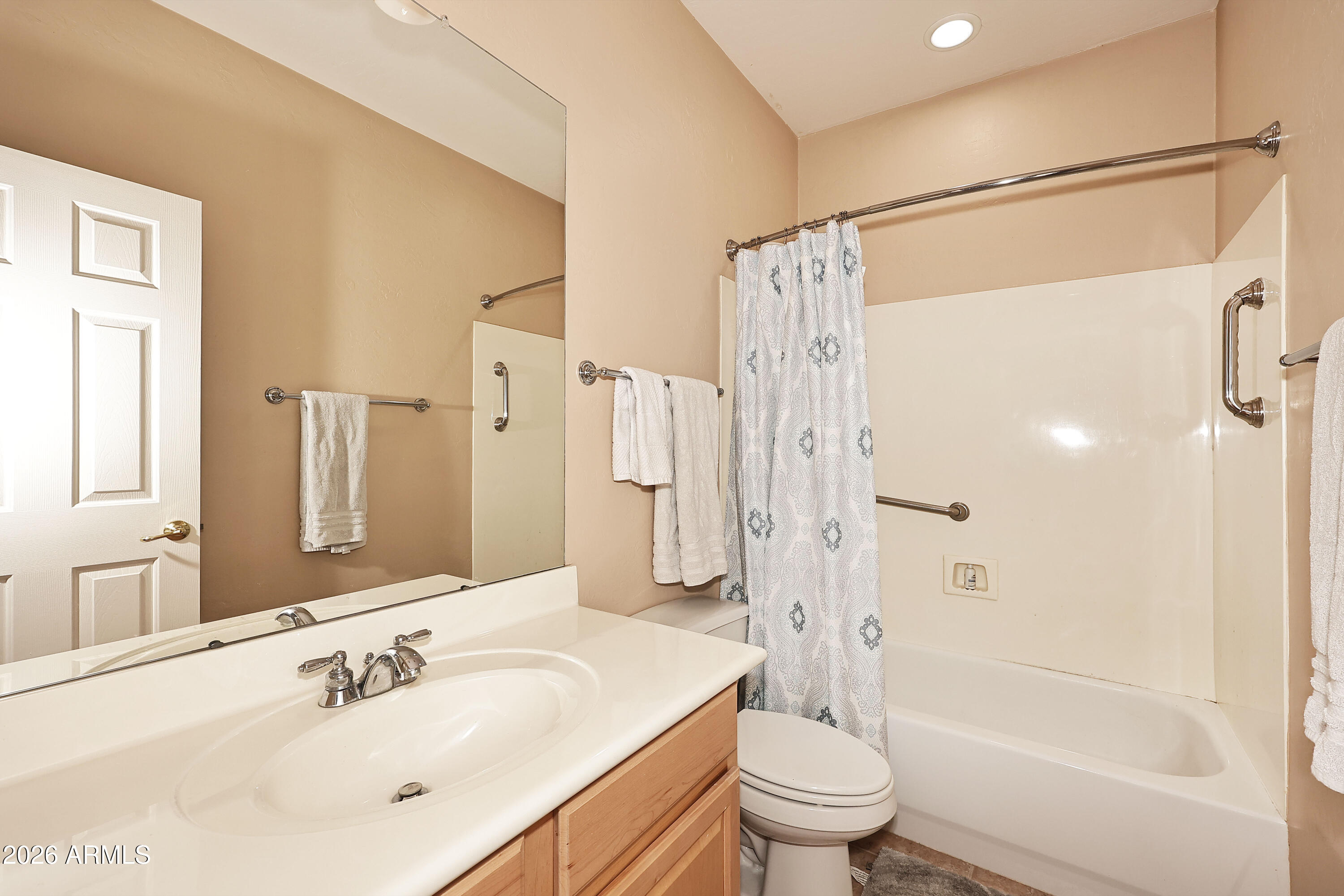 2635 East Darrel Road Phoenix, AZ 85042 - Photo 26 of 27 a bathroom with a sink a toilet and a large mirror