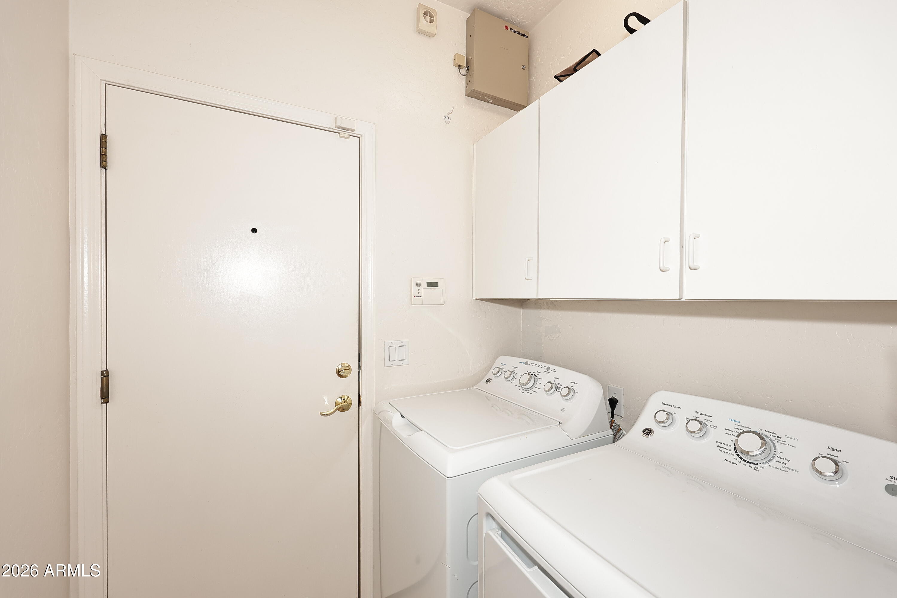 2635 East Darrel Road Phoenix, AZ 85042 - Photo 27 of 27 a utility room with dryer and washer
