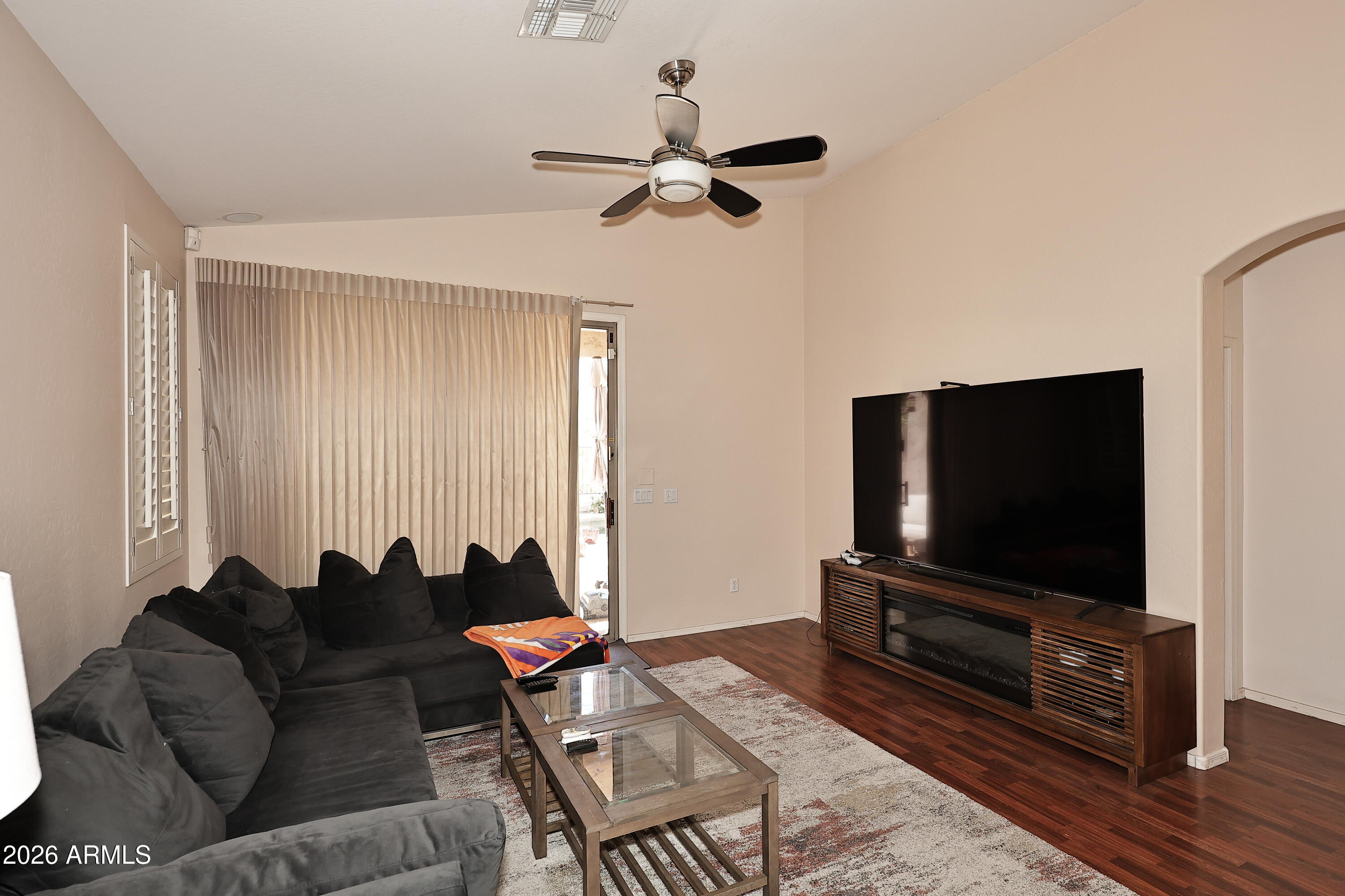 2635 East Darrel Road Phoenix, AZ 85042 - Photo 6 of 27 a living room with furniture and a flat screen tv