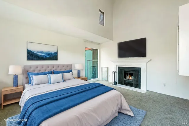 a view of an empty room with a fireplace