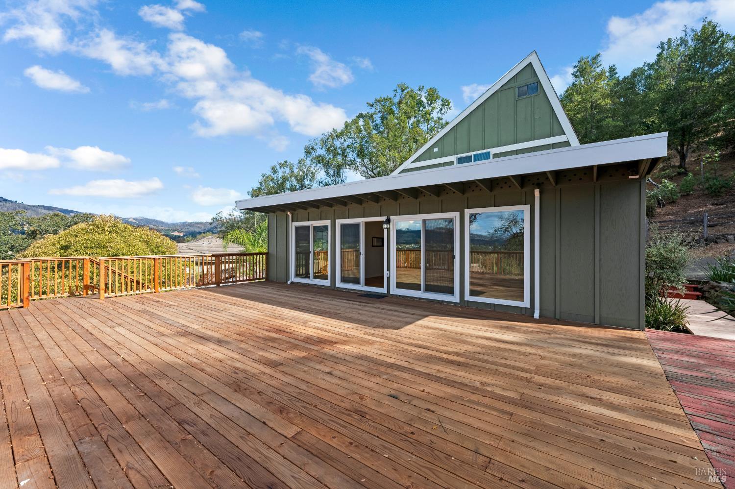 5550 Pepperwood Road Santa Rosa, CA 95409 - Photo 2 of 35 a view of a house with wooden floor and a yard