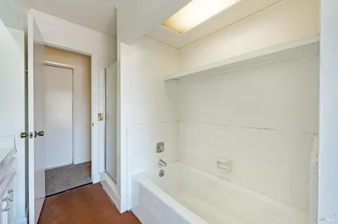 a view of a small house with a deck