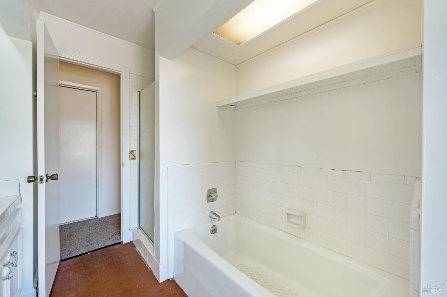 5550 Pepperwood Road Santa Rosa, CA 95409 - Photo 21 of 35 a bathroom with a bathtub and a shower