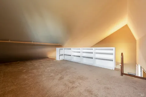 a bathroom with a sink mirror vanity and toilet