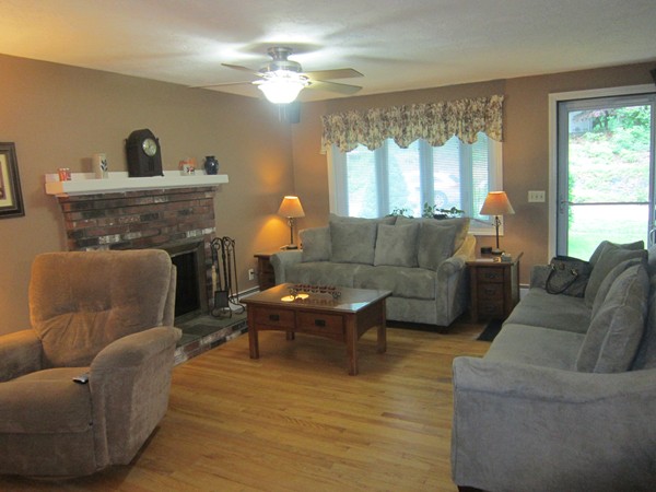 6 Karen Way Rutland, MA 01543 - Photo 3 of 15 a living room with furniture and a fireplace