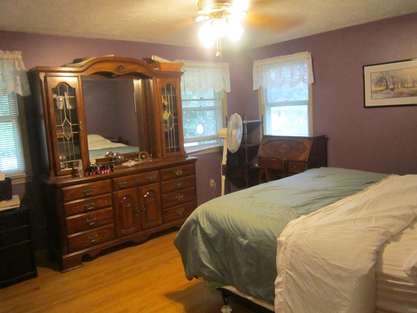 6 Karen Way Rutland, MA 01543 - Photo 8 of 15 a bedroom with a bed and a mirror on dresser