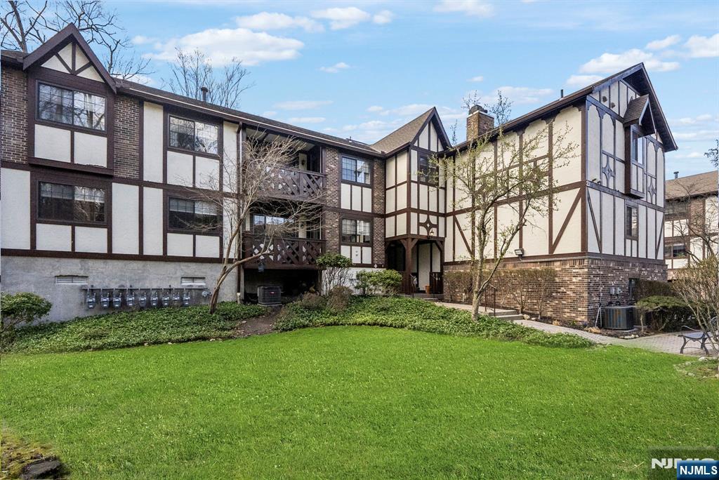 2309 Hemingway Lane, Unit 2309 Mahwah, NJ 07430 - Photo 1 of 28 front view of house with a yard
