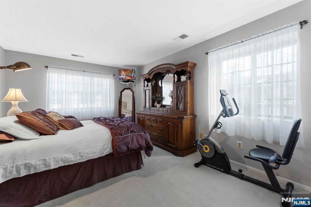 2309 Hemingway Lane, Unit 2309 Mahwah, NJ 07430 - Photo 14 of 28 a bedroom with bed and windows