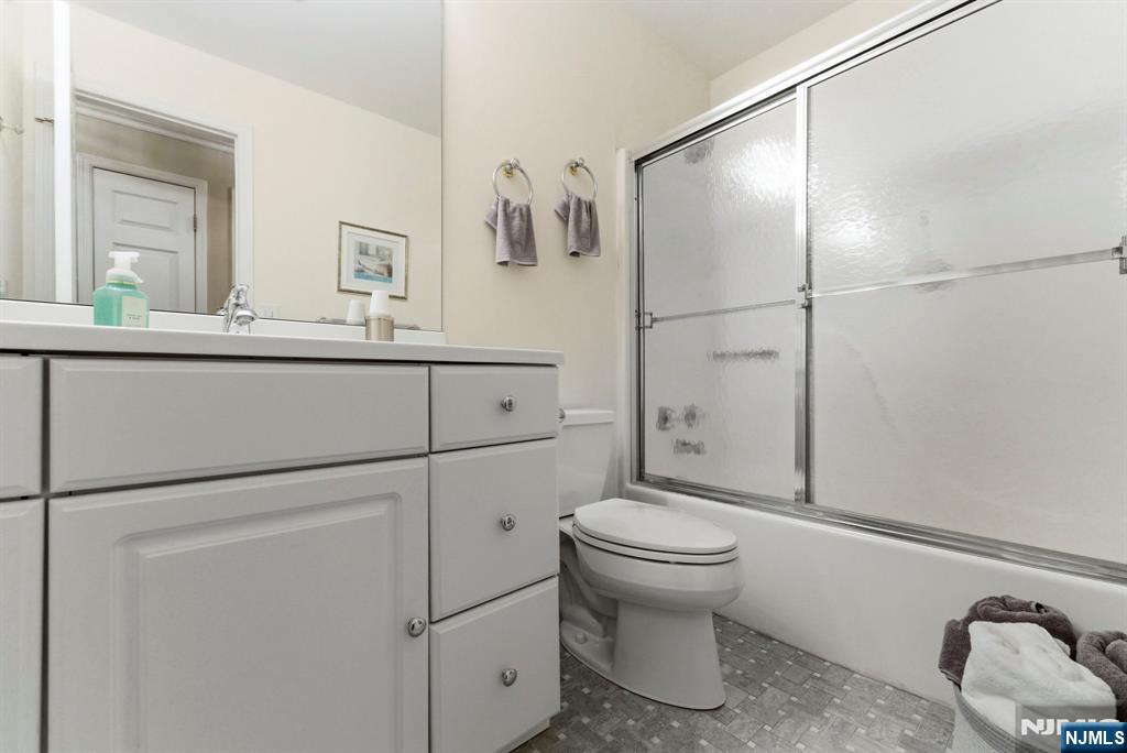 2309 Hemingway Lane, Unit 2309 Mahwah, NJ 07430 - Photo 17 of 28 a bathroom with a toilet sink and shower