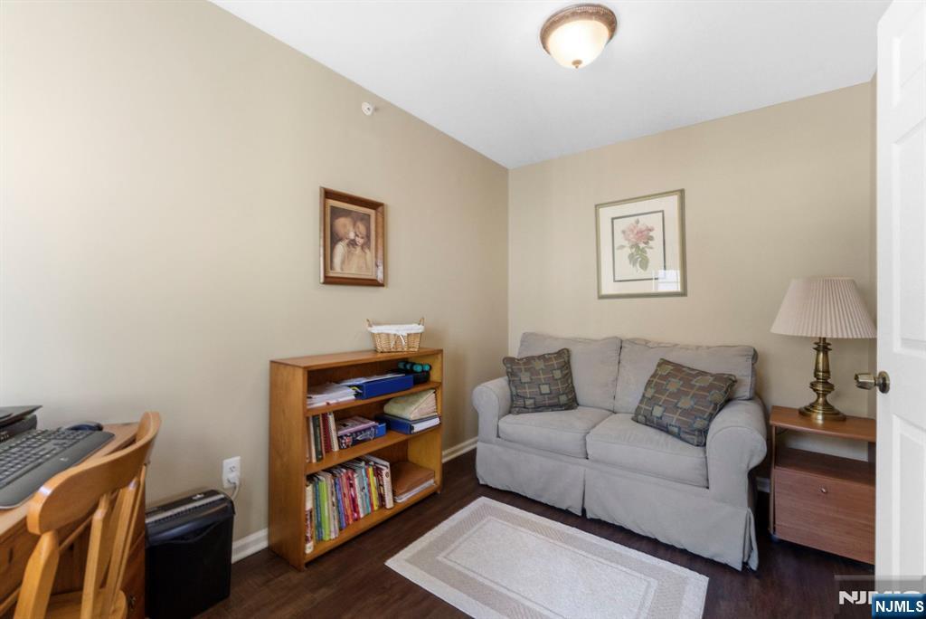 2309 Hemingway Lane, Unit 2309 Mahwah, NJ 07430 - Photo 18 of 28 a living room with furniture and a window