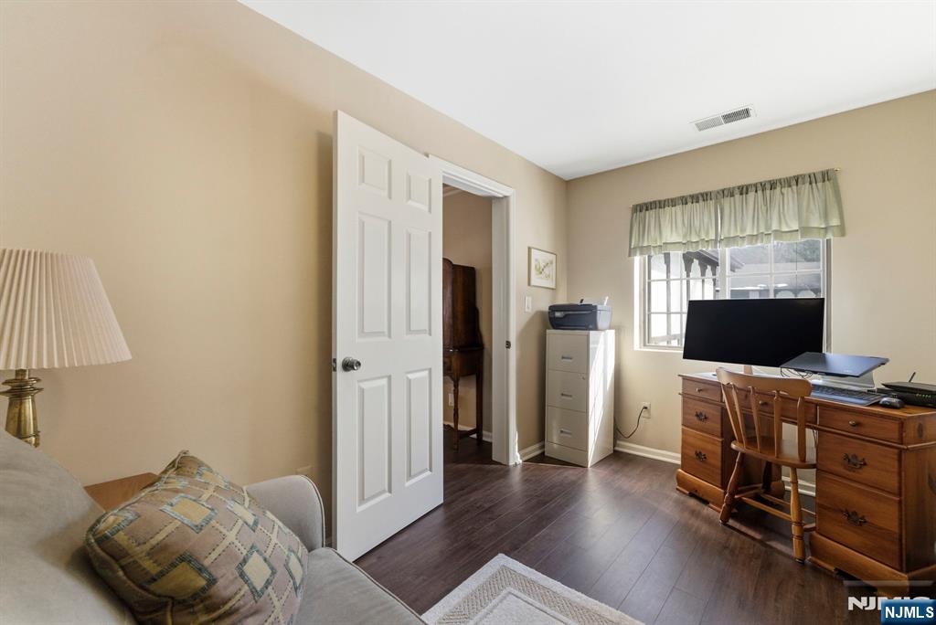 2309 Hemingway Lane, Unit 2309 Mahwah, NJ 07430 - Photo 19 of 28 a bedroom with furniture and a flat screen tv
