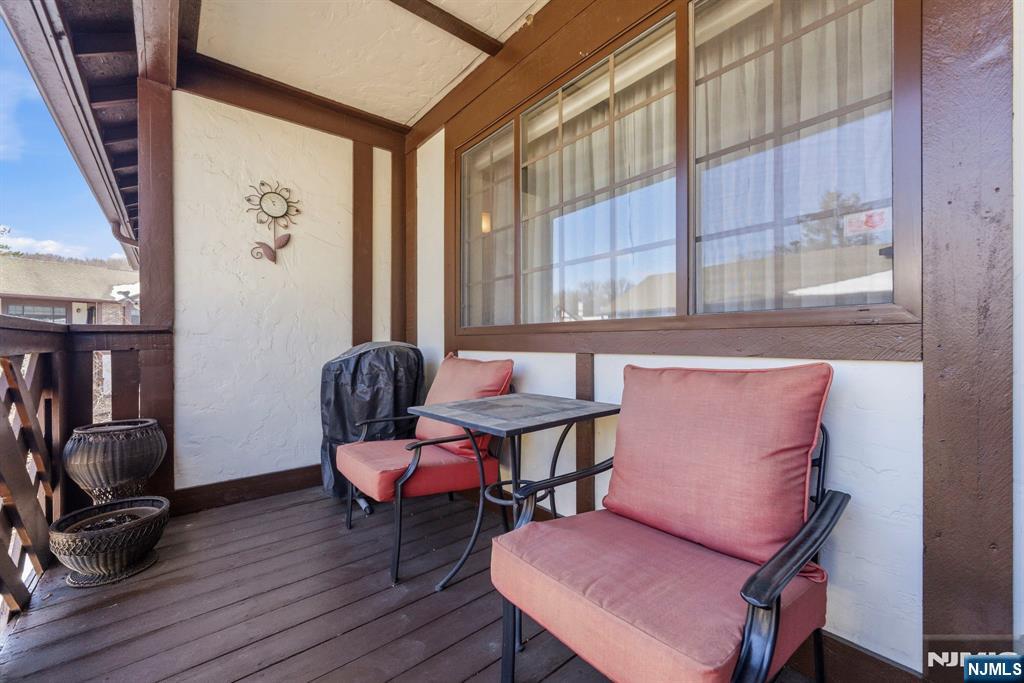 2309 Hemingway Lane, Unit 2309 Mahwah, NJ 07430 - Photo 20 of 28 a view of a livingroom with lounge chair and a large window