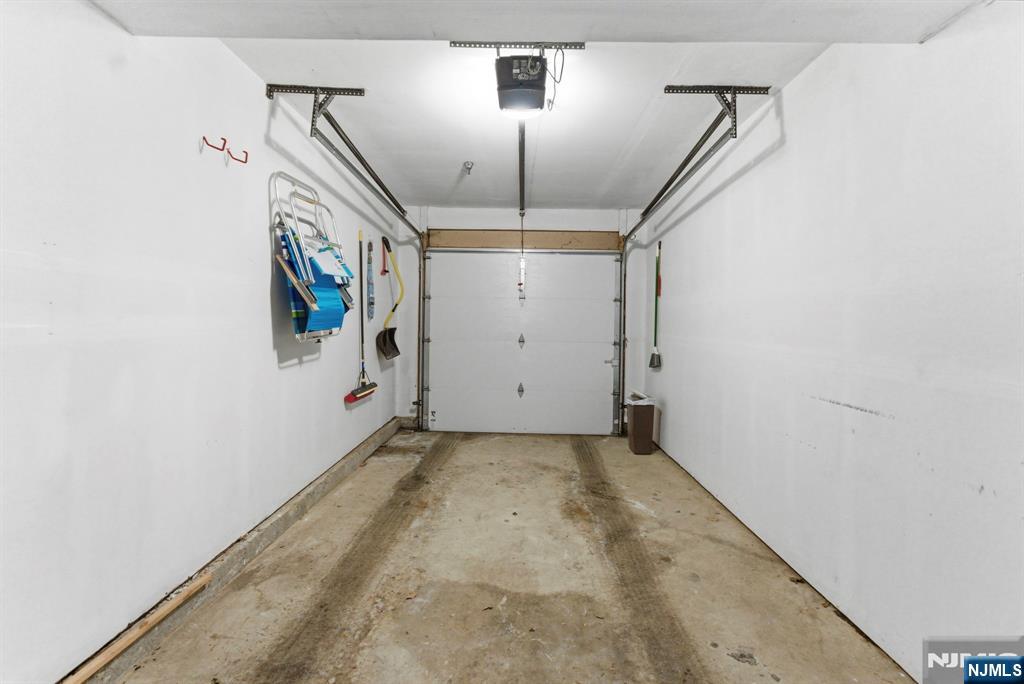 2309 Hemingway Lane, Unit 2309 Mahwah, NJ 07430 - Photo 28 of 28 a view of a hallway with a white walls