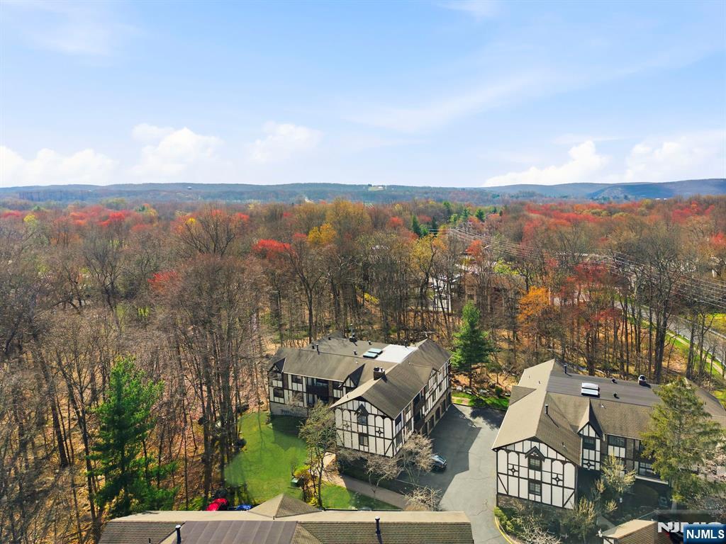 2309 Hemingway Lane, Unit 2309 Mahwah, NJ 07430 - Photo 3 of 28 an aerial view of a house with a yard and lake view
