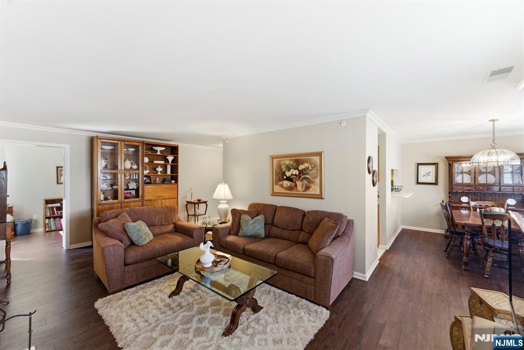 2309 Hemingway Lane, Unit 2309 Mahwah, NJ 07430 - Photo 8 of 28 a living room with furniture and wooden floor