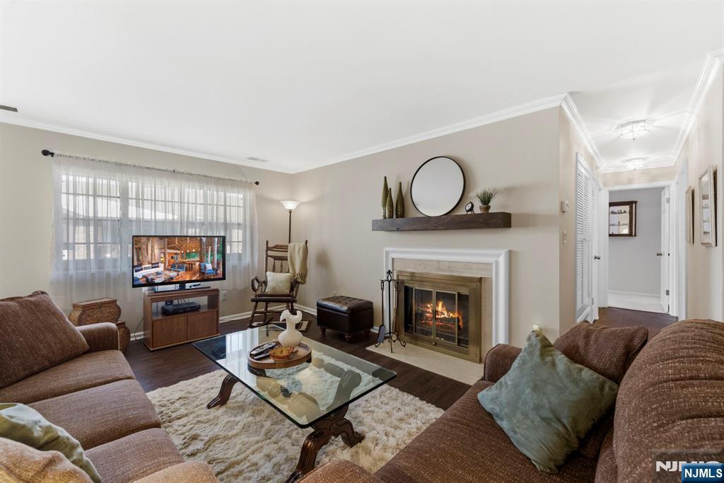 2309 Hemingway Lane, Unit 2309 Mahwah, NJ 07430 - Photo 9 of 28 a living room with furniture and a fireplace
