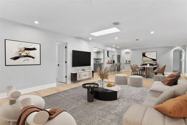 a kitchen with granite countertop a sink cabinets and stainless steel appliances