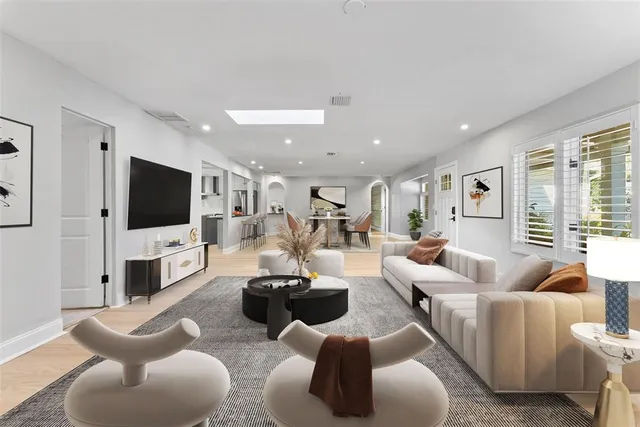 a kitchen with stainless steel appliances granite countertop a stove a refrigerator and a white cabinets