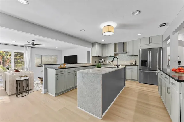 a living room with bed and flat screen tv