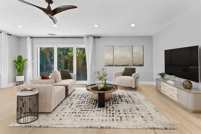 a bedroom with a large bed and a couch