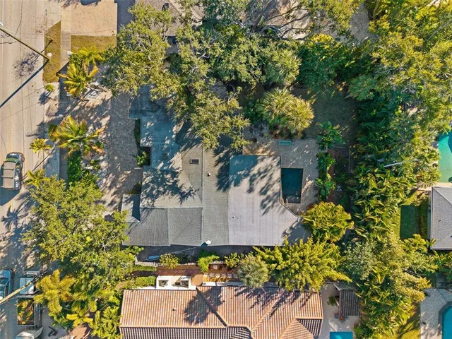 an aerial view of a house with a yard and garden