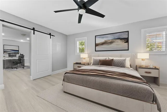 a spacious bathroom with a double vanity sink a mirror and a shower