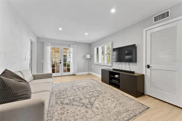 a bathroom with a toilet a sink and a window