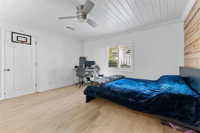 a view of backyard with outdoor seating and plants