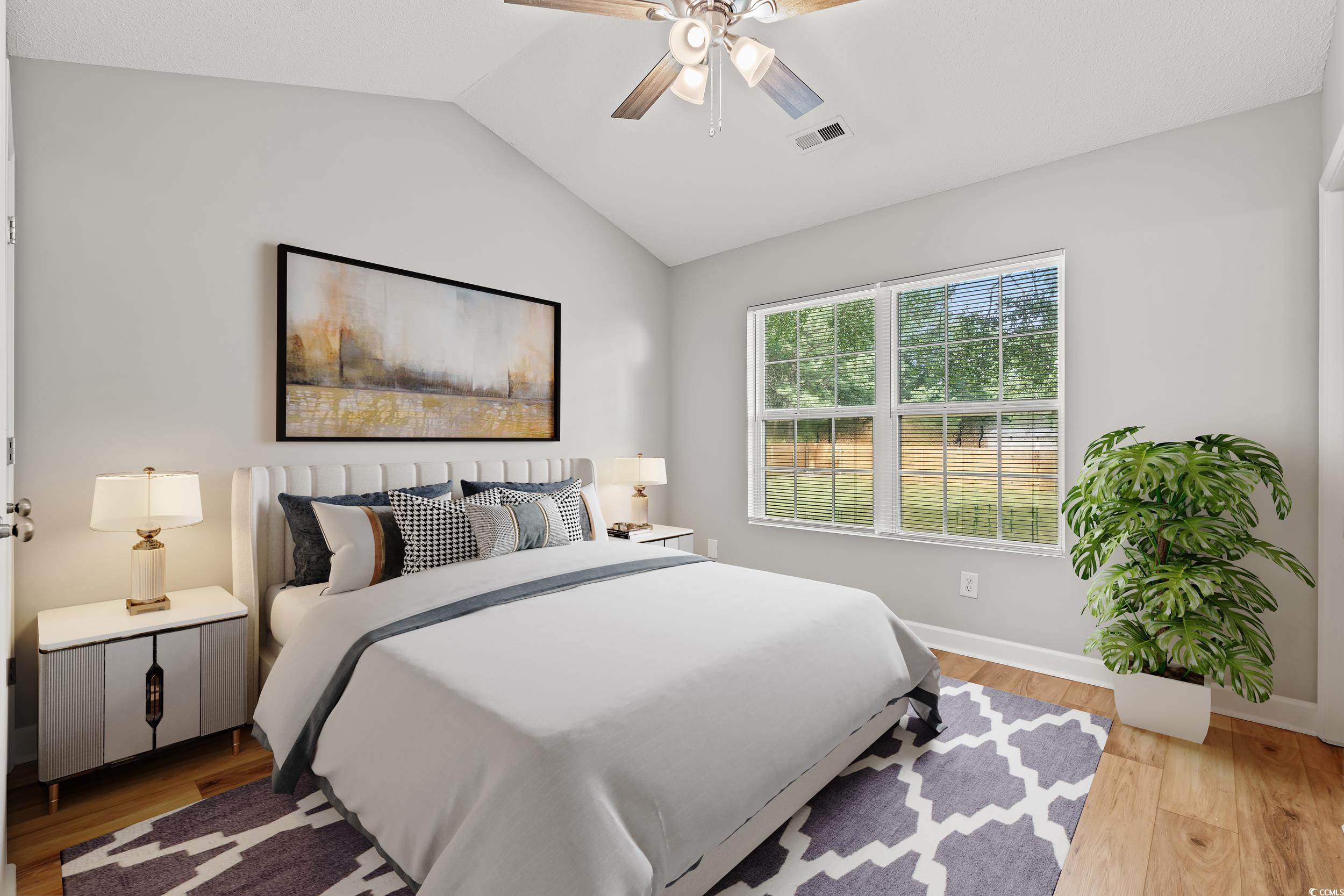 2965 Mt Olive Road Loris, SC 29569 - Photo 14 of 35 Bedroom featuring vaulted ceiling, light wood-styl