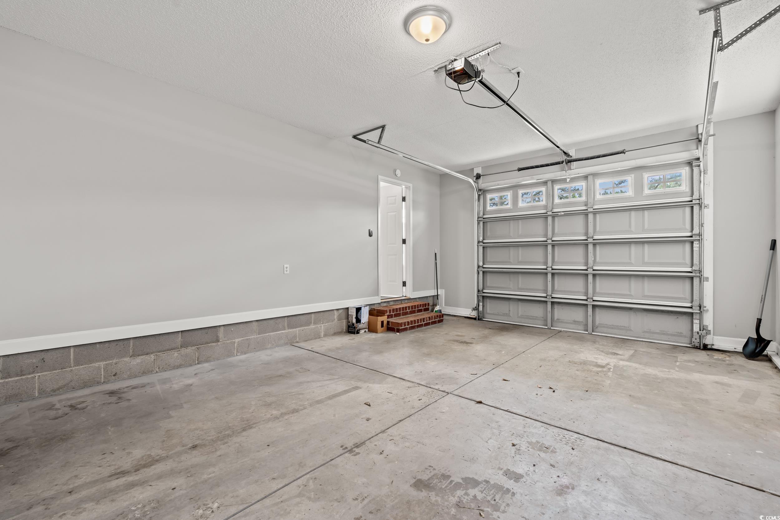 2965 Mt Olive Road Loris, SC 29569 - Photo 27 of 35 Garage with a garage door opener