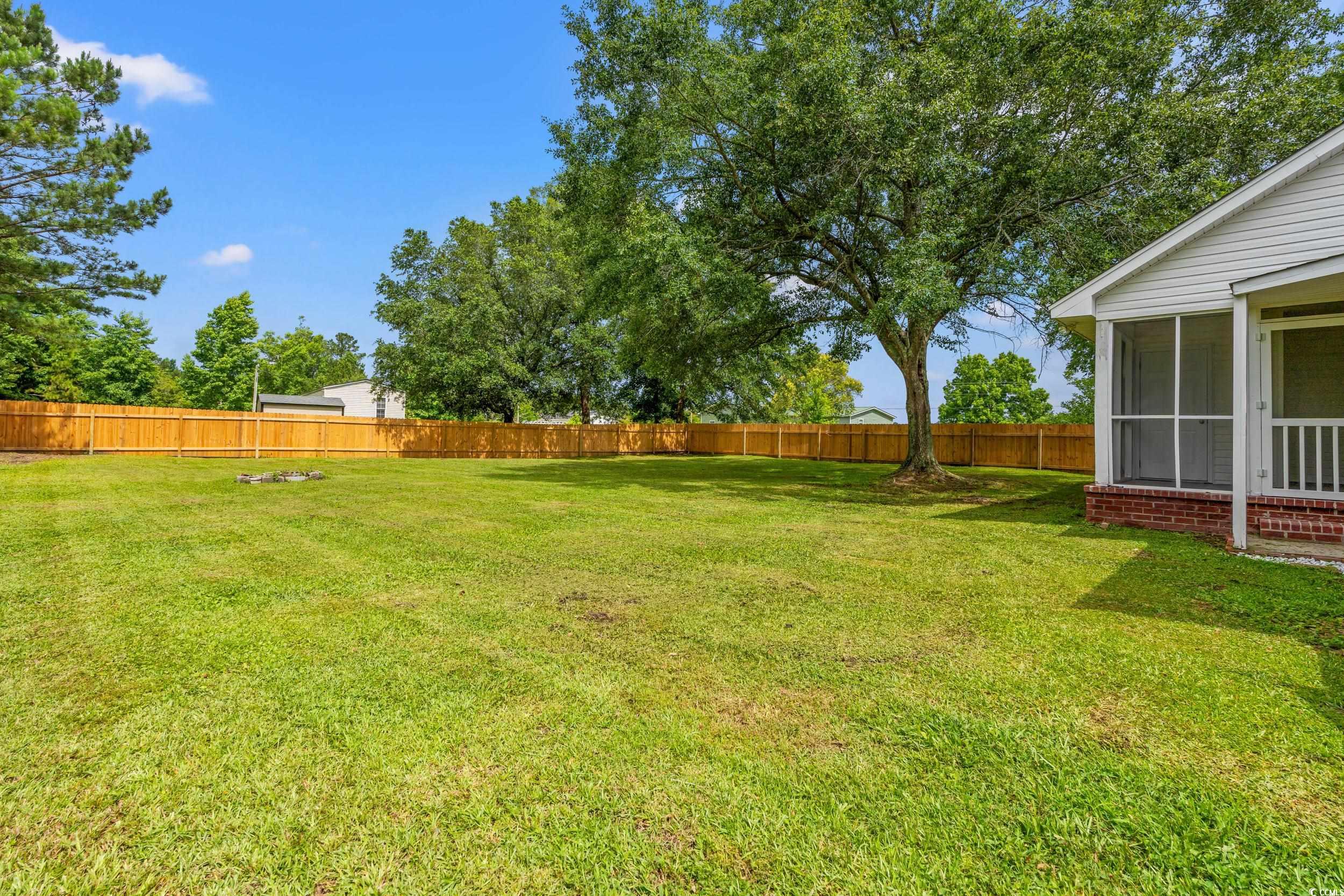 2965 Mt Olive Road Loris, SC 29569 - Photo 30 of 35 Fenced backyard with a sunroom