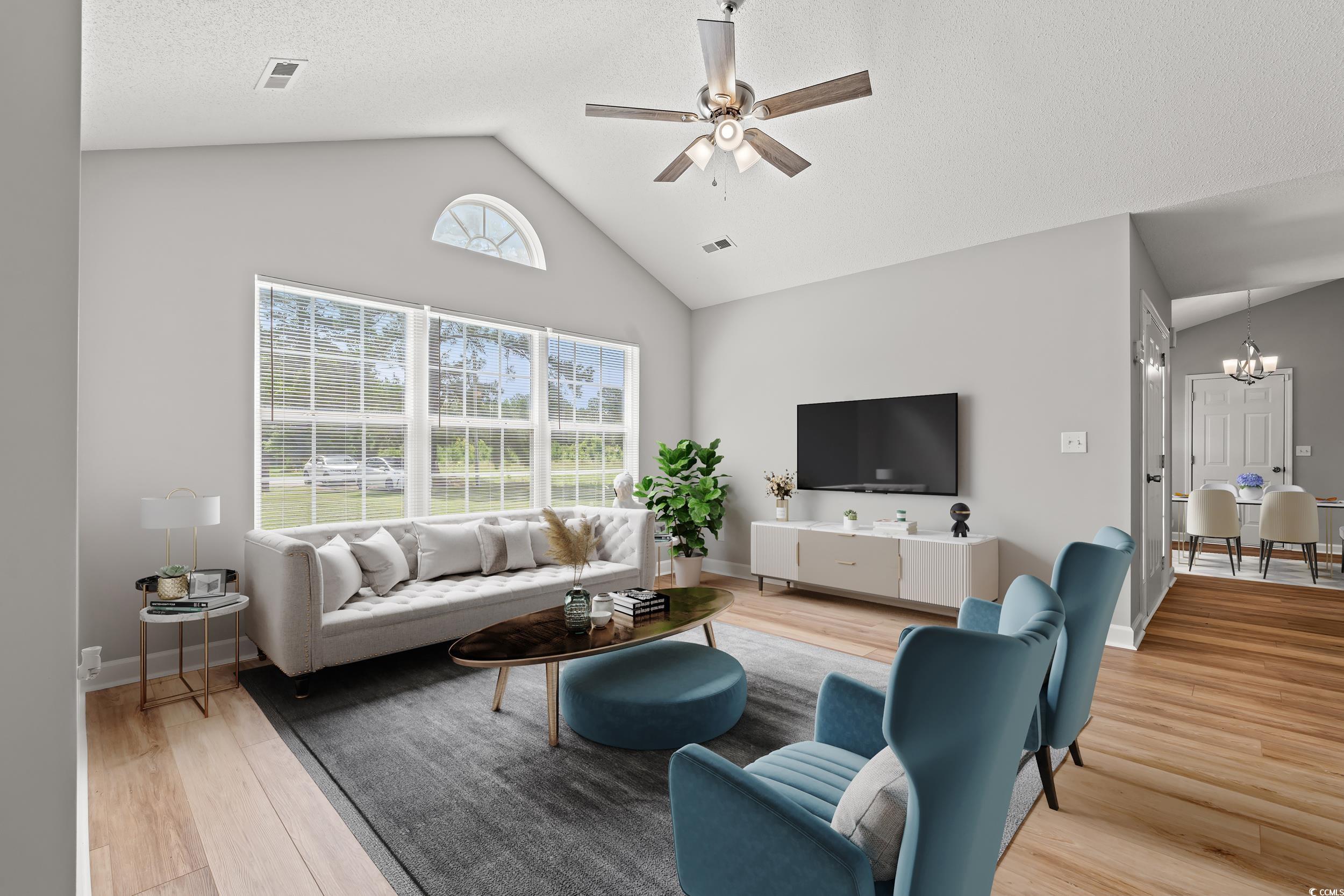 2965 Mt Olive Road Loris, SC 29569 - Photo 7 of 35 Living area featuring a chandelier, light wood fin