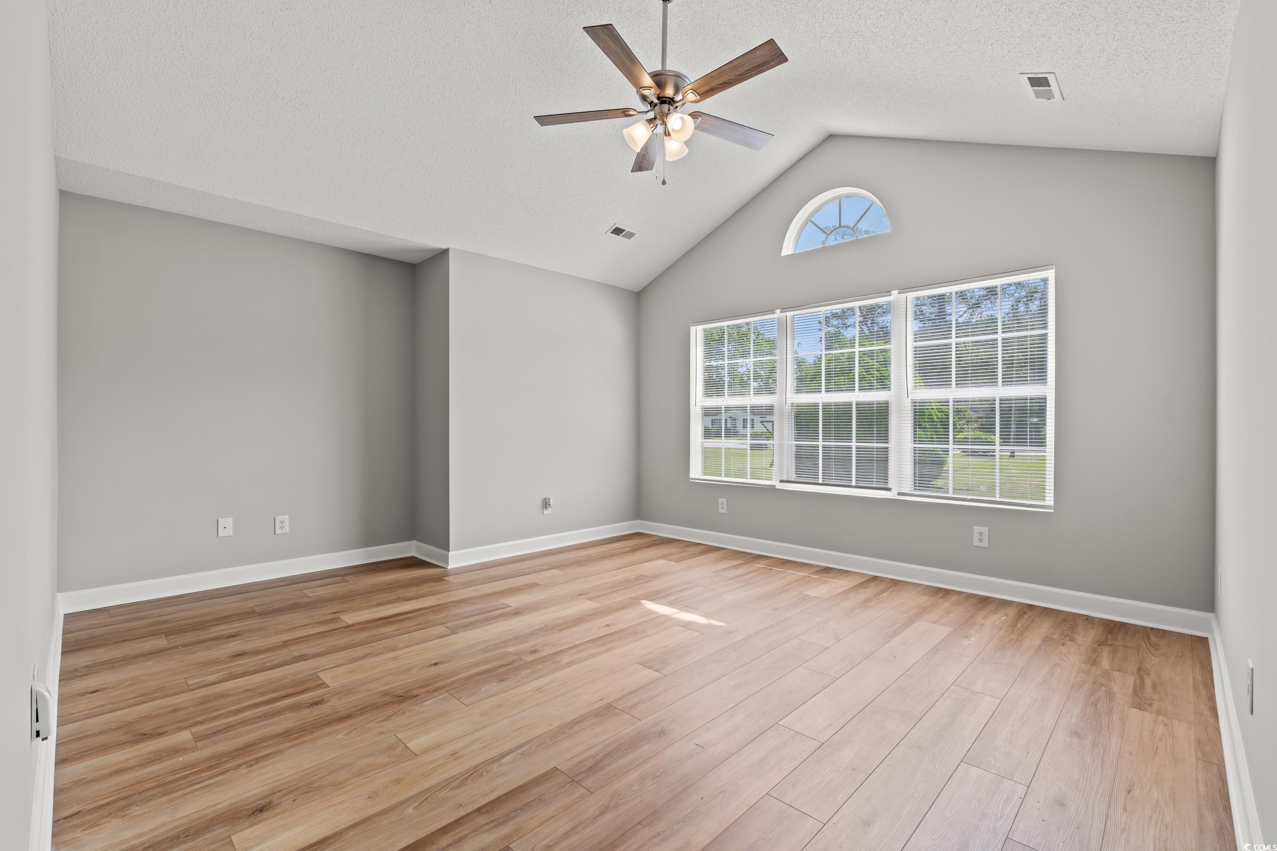 2965 Mt Olive Road Loris, SC 29569 - Photo 9 of 35 Empty room with ceiling fan, light wood finished f