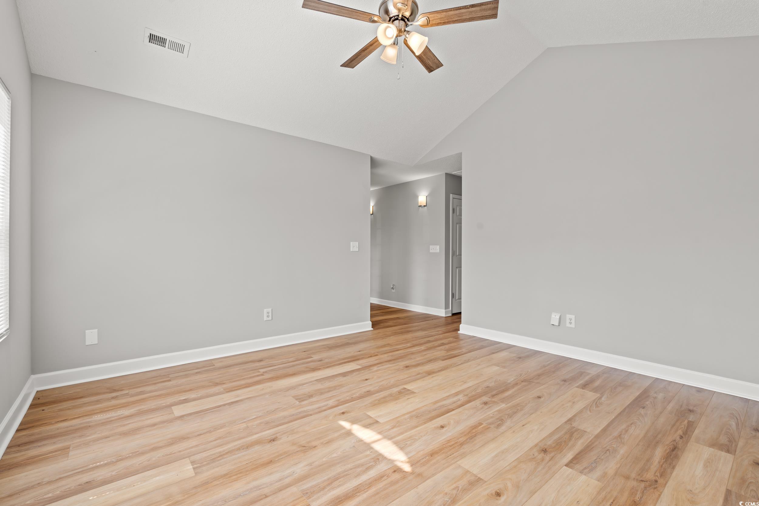 2965 Mt Olive Road Loris, SC 29569 - Photo 10 of 35 Empty room featuring a ceiling fan, light wood-sty