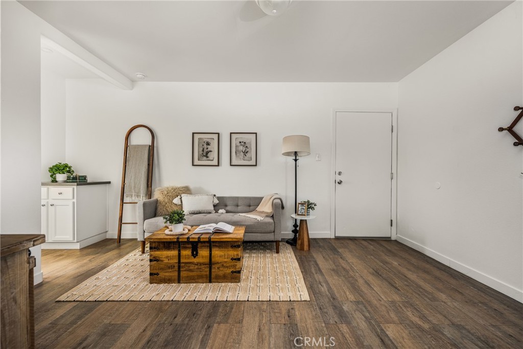 6725 Perry Road Bell Gardens, CA 90201 - Photo 15 of 40 a living room with furniture and wooden floor