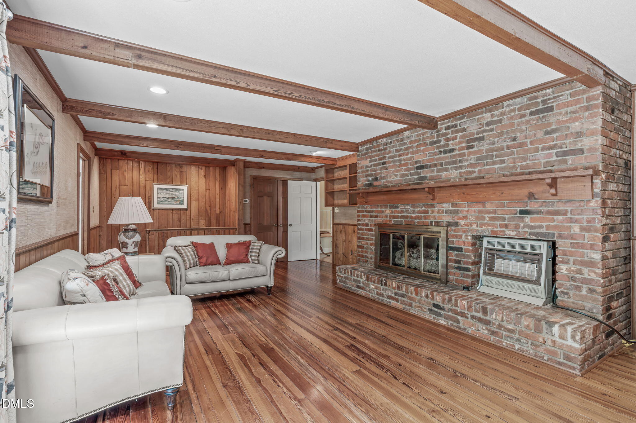 1205 Kimberly Drive Raleigh, NC 27609 - Photo 10 of 45 a living room with furniture and a fireplace